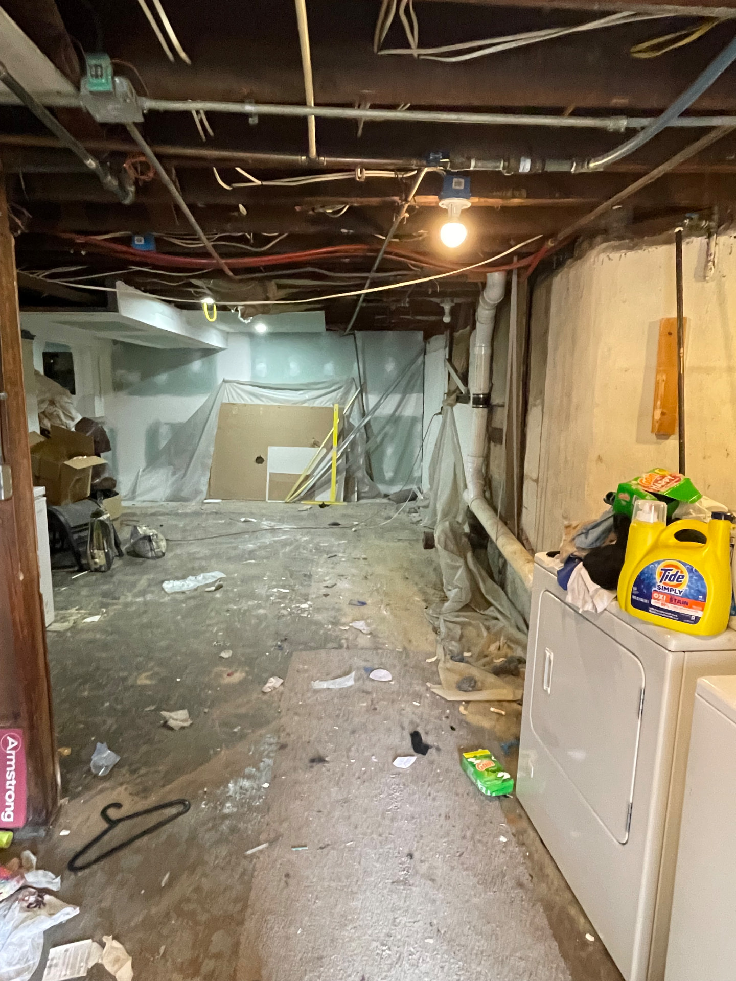 Basement in Parkville cleared out during a junk removal job, with debris, bags and old items removed